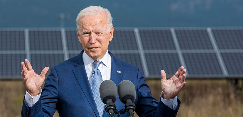 A person speaking at a podium.