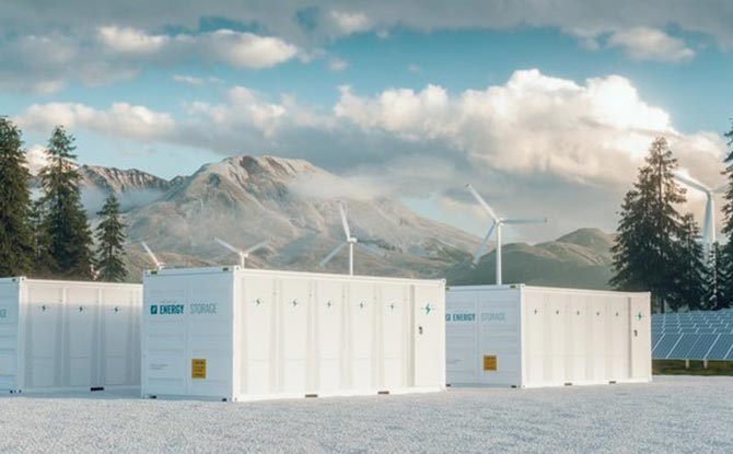 Different types of renewables in front of a mountain.