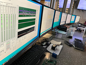 Computer displays with data inside research laboratory.