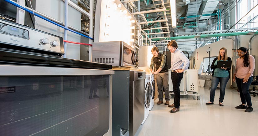 People standing in the NREL Systems Performance Laboratory.