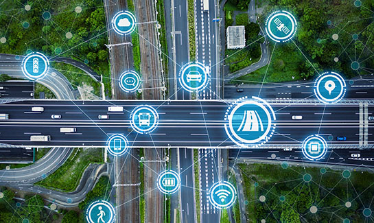 Traffic-related icons overlayed on an aerial view of intersecting highways.