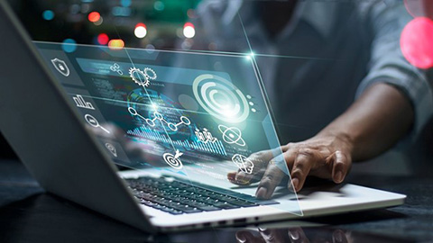 A hand on a computer