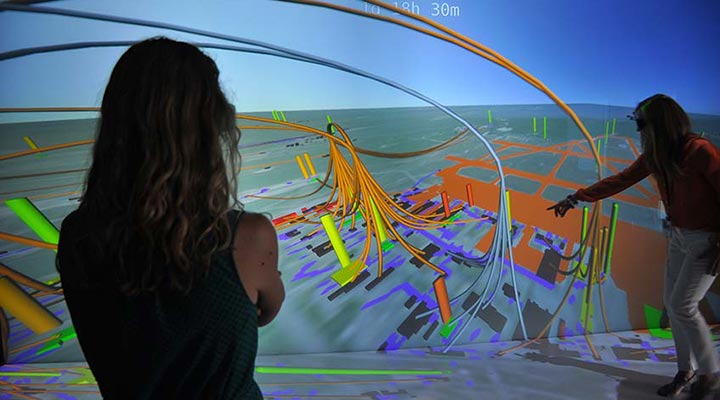 Two researchers review a data visualization