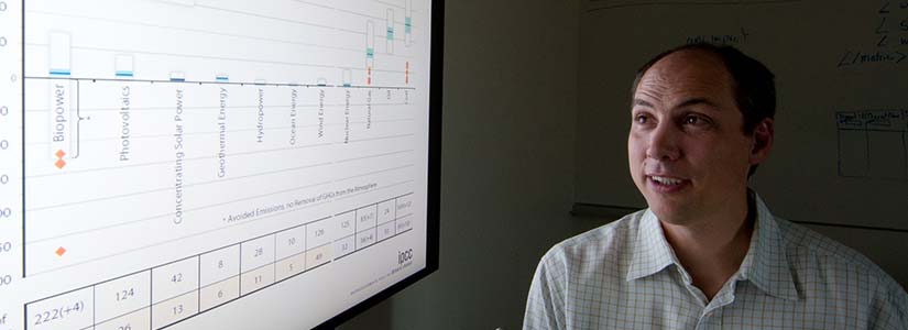 Researcher projects an analysis table to a large screen.
