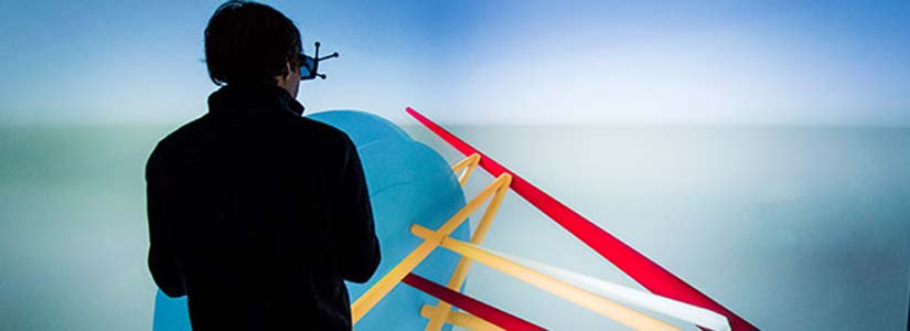 A student from Colorado School of Mines explores a 3D visualization in ESIF's Insight Center depicting a series of tunnels and boreholes in a mine in South Dakota. 