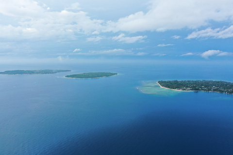 Aerial photo of Indonesian islands in the middle of the ocean.