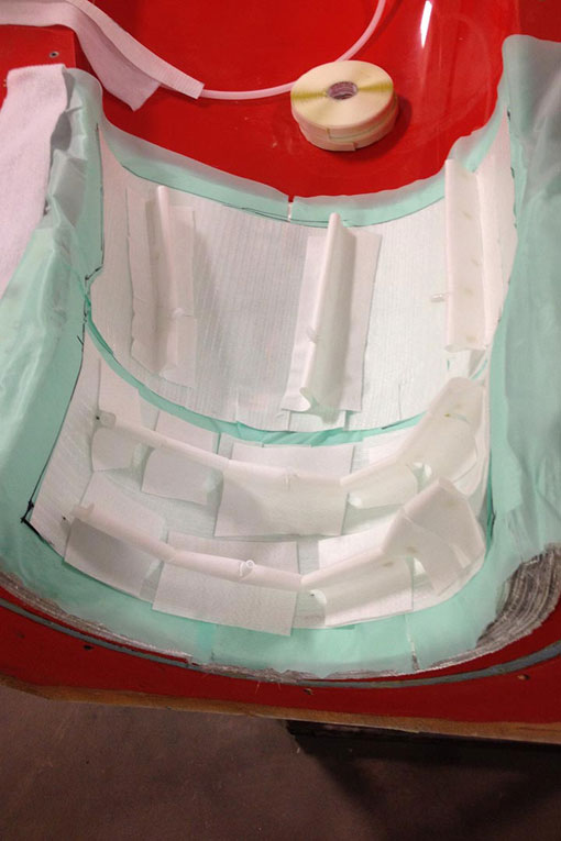 The thermoplastic blade section manufacturing process involves a second layer of fiberglass and Compoflex flow media.