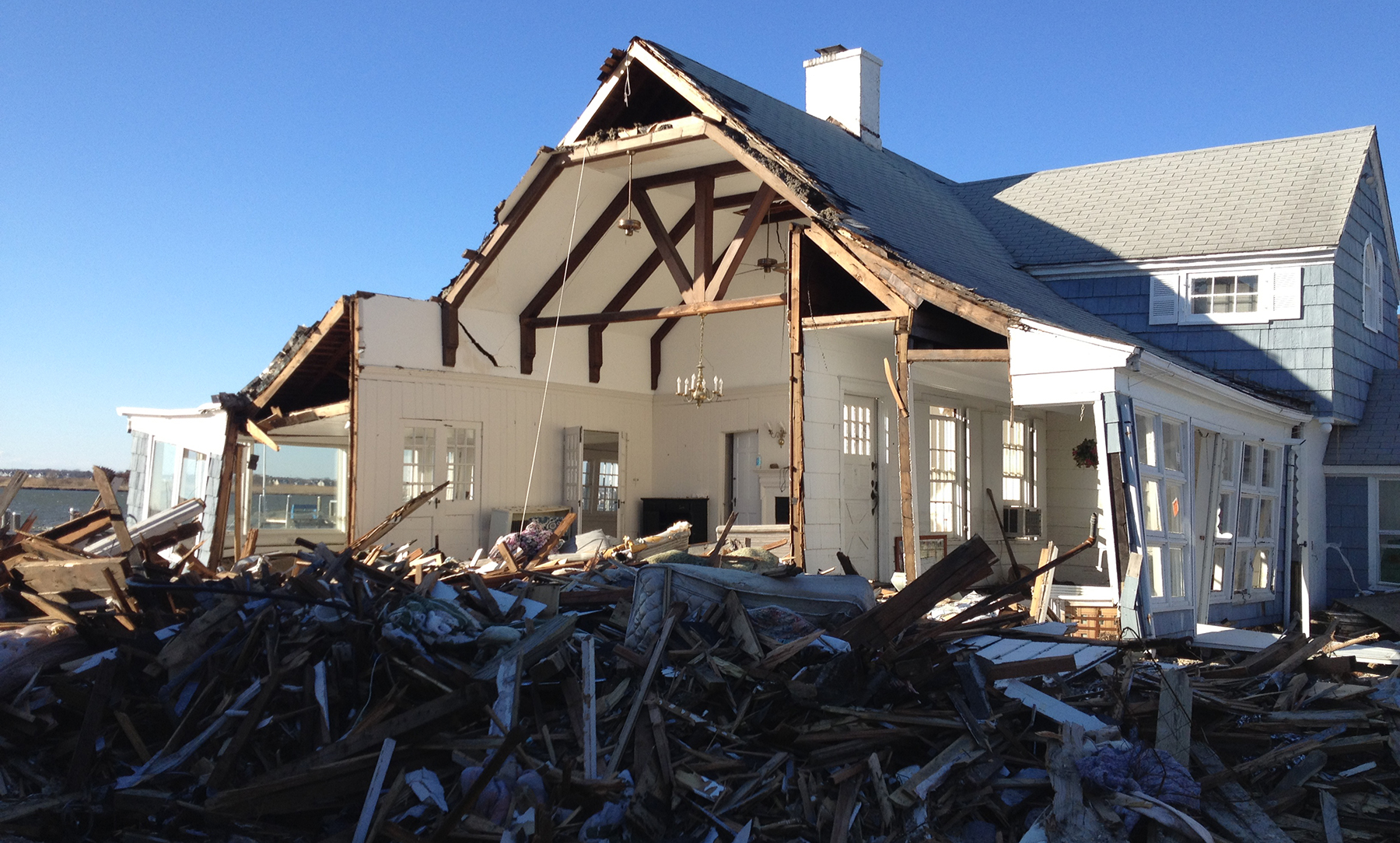 Photo of house with significant hurricane damage.