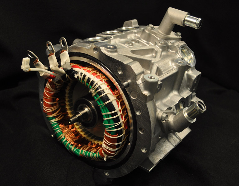 A silver electric motor with colored wires wrapped around the front