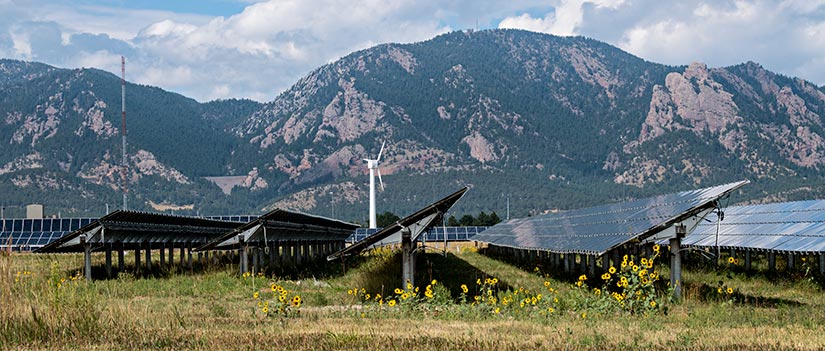 Photo of solar photovoltaic array with wind turbine