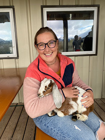 Lanaia Carveth holds a baby goat