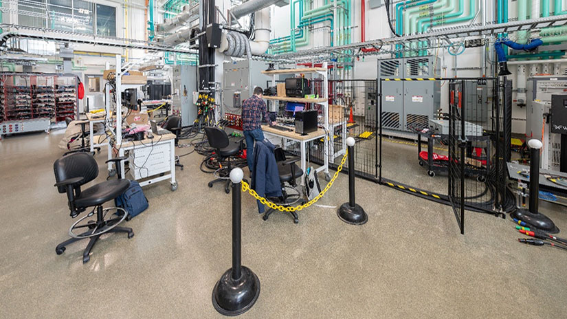 A large room containing cables, computers, and other electronics