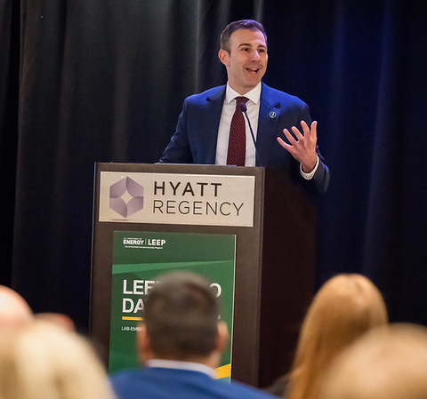 A man speaking at a podium. 