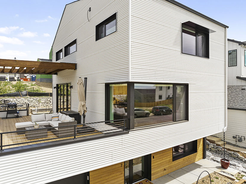 The exterior of a home with a deck.