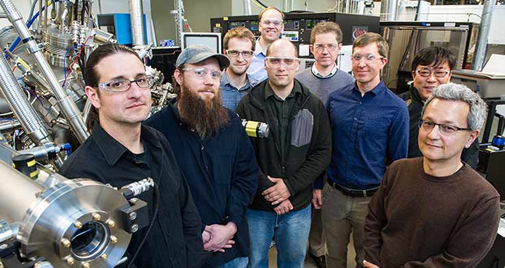 A group of men smiling