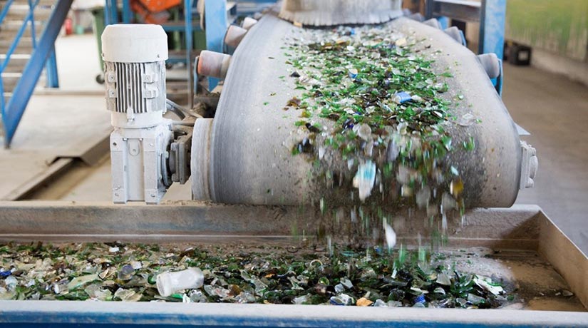 Conveyer belt with recycled materials on it.