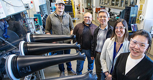 Photo of four researchers in a lab.