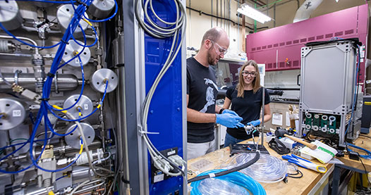 Two researchers working in a lab.