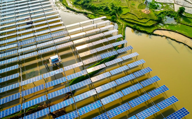 Aerial photo of solar panels in a field.
