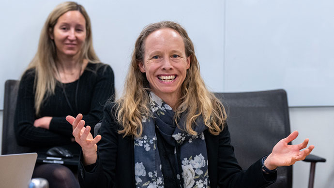 Person speaking during presentation.