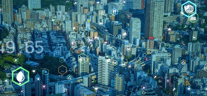 Aerial view of large metropolitan city with energy icons overlayed.