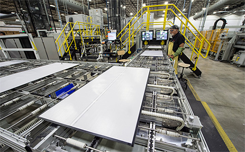 A worker in a solar module manufacturing plant.