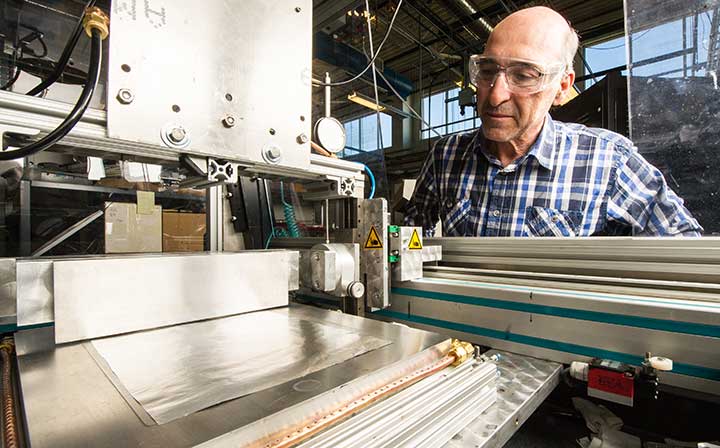 A researcher working with scientific equipment in a laboratory setting 