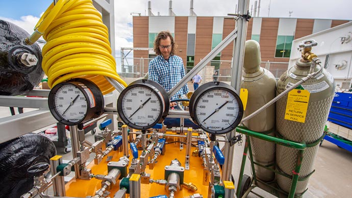 A man working with lab equipment.