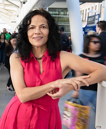 Portrait photo of woman at train station.