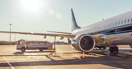 An airplane refueling on the tarmac.