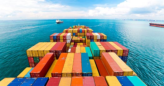 Shipping containers on a cargo ship at sea.