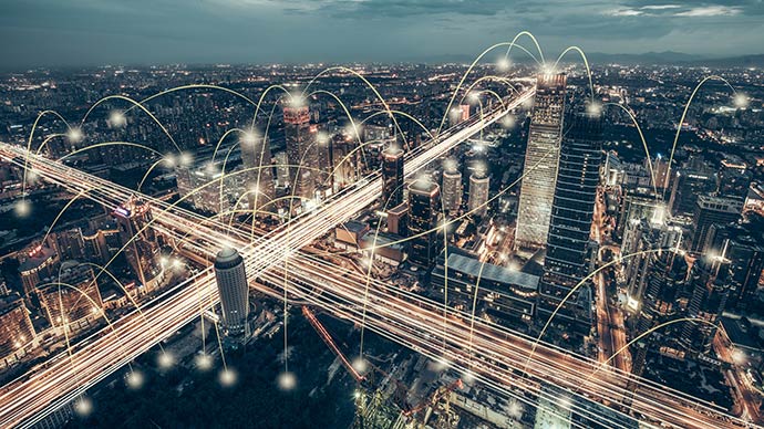 An aerial photo of a city with illustrated lines.