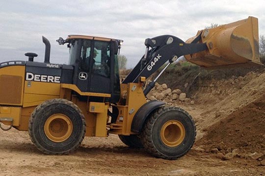 A tractor moving dirt.