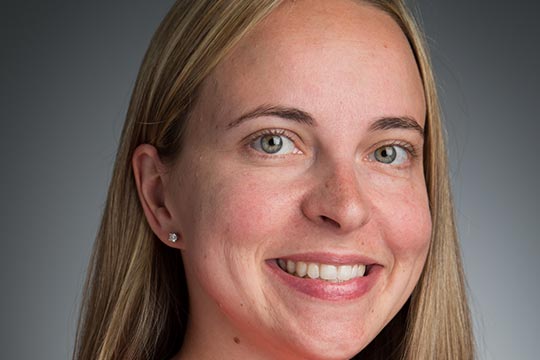 A picture of a smiling woman.