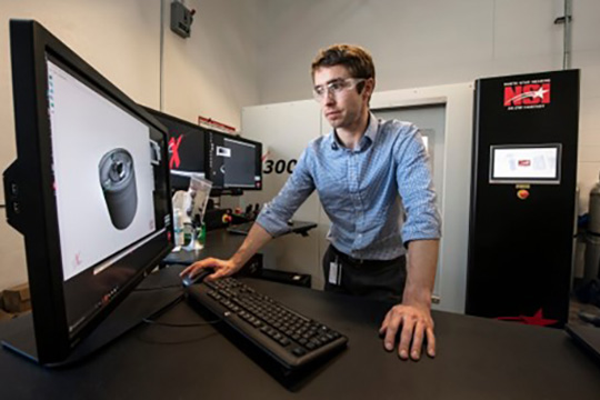 A researcher looking at a computer.