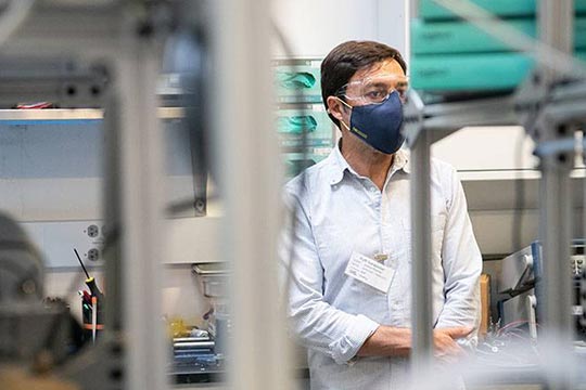 A person standing in a laboratory.