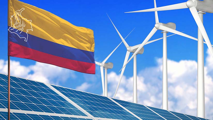 Photo showing a flag, solar panels, and wind turbines.