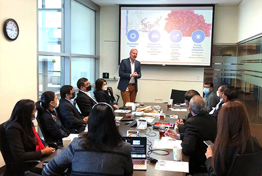 The EGAT team listens to a presentation in an NREL conference room.
