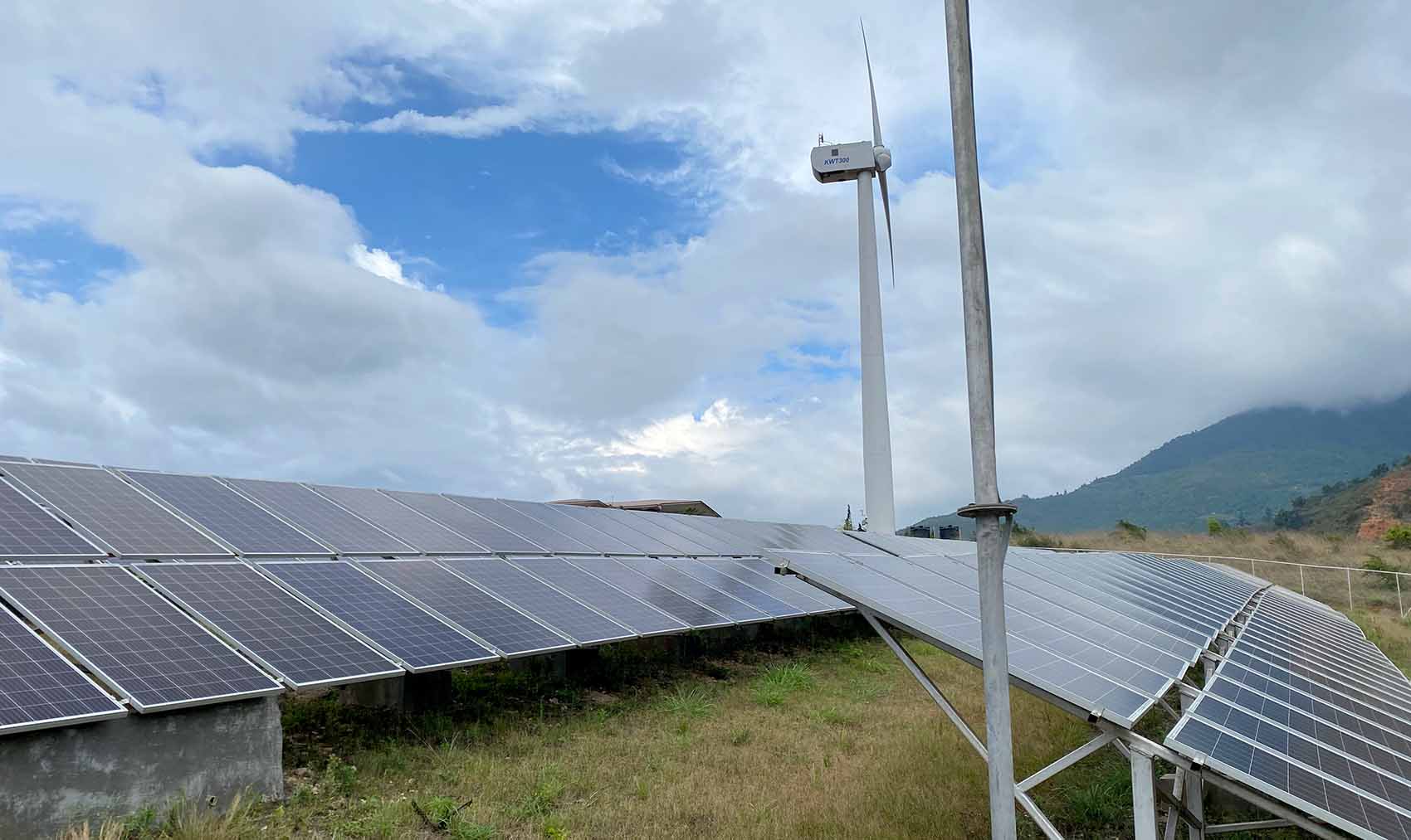  A solar PV installment with a small wind turbine nearby.