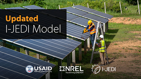 Image announces an Updated I-JEDI Model with the logos for USAID, NREL, and I-JEDI. Two workers are using tools to complete the installation of solar panels.