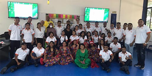 A group of people standing and sitting.