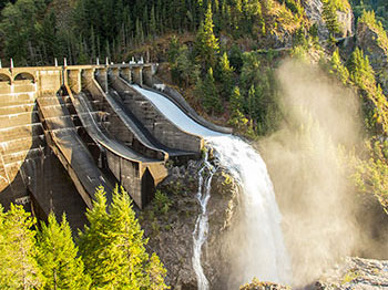 Hydropower dam with a mountain in the background