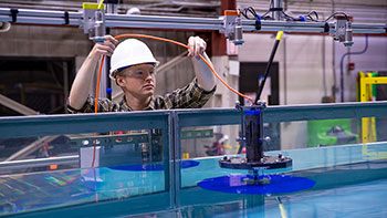 Researcher working in the wave take at NREL's Flatirons Campus