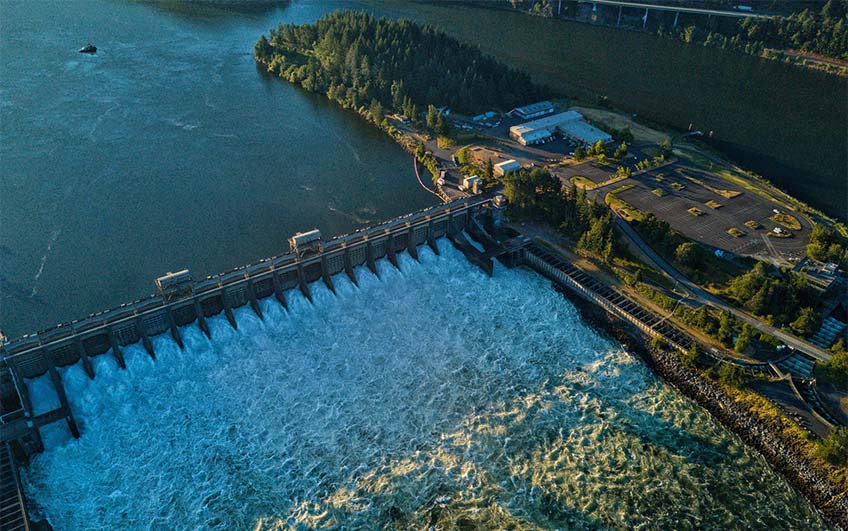 Aerial photo of water flowing through a hydropower plant.