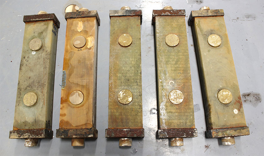 Five blocks of materials on a table.