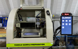 A beige plastic container is open on the curved front to reveal mechanisms within. A touch screen is off to the side reading "ELEMENT"